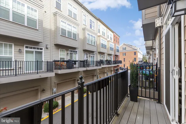 a front view of a residential apartment building with a yard