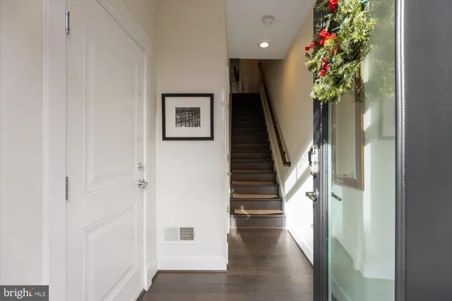 a view of entryway with wooden floor