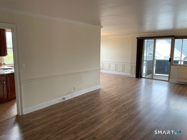 50 Glenbrook Road, Unit 5G Stamford, CT 06902 - Photo 19 of 40 an empty room with wooden floor and windows