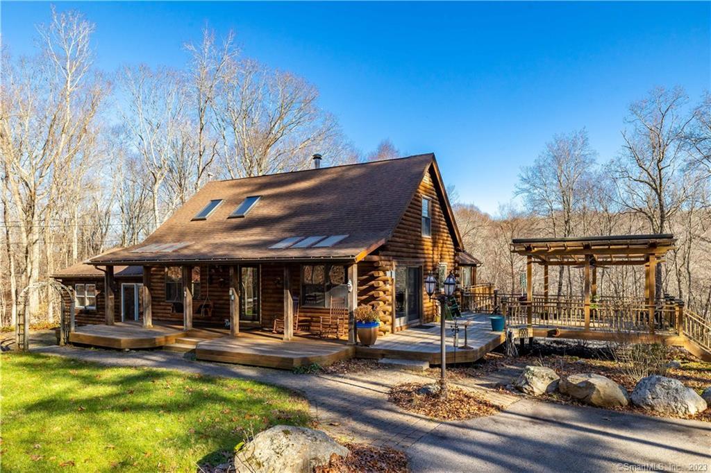 24 Alexander Road East Haddam, CT 06415 - Photo 1 of 1 a view of a house with sitting area and a swimming pool