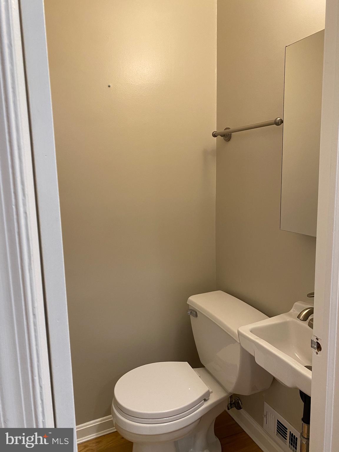 339 11th Street Southeast Washington, DC 20003 - Photo 17 of 39 a white toilet sitting next to a small sink