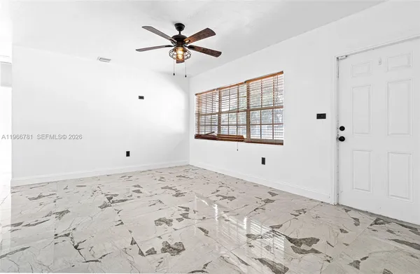 a view of a bedroom with a natural light