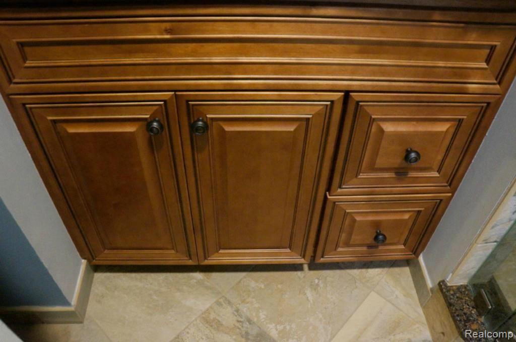 5437 Bishop Road Dryden, MI 48428 - Photo 17 of 41 #17 bath cabinet & flooring.jpg