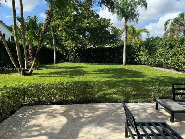 a view of a patio with a yard