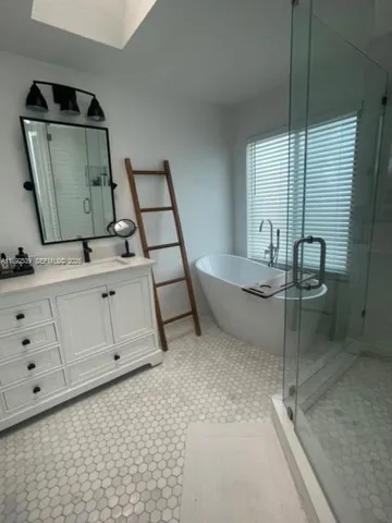 a bathroom with a sink and mirror