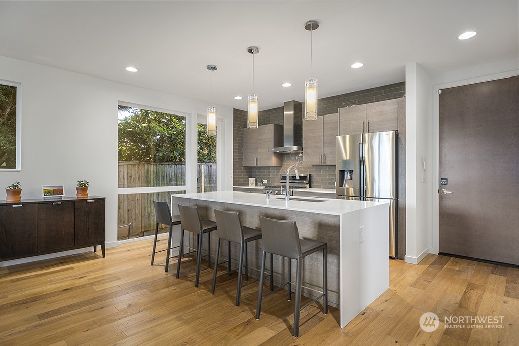 1406 South Bennett Street Seattle, WA 98108 - Photo 11 of 36 a large kitchen with lots of counter space and windows