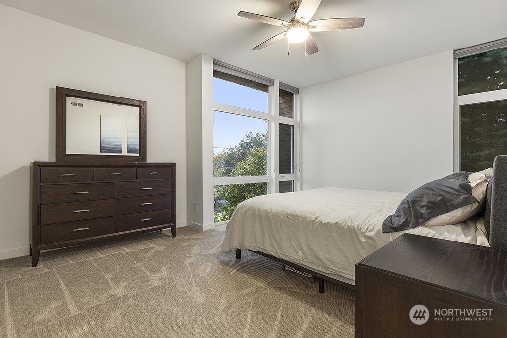 1406 South Bennett Street Seattle, WA 98108 - Photo 15 of 36 a bedroom with a bed and a dresser