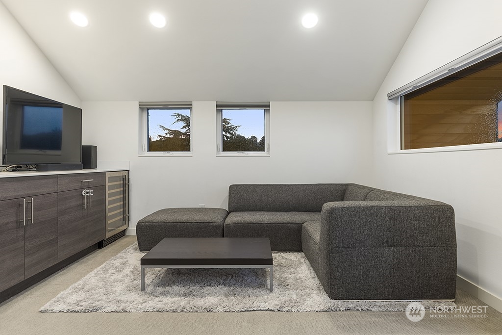 1406 South Bennett Street Seattle, WA 98108 - Photo 23 of 36 a living room with furniture and a flat screen tv