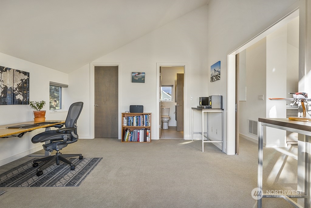 1406 South Bennett Street Seattle, WA 98108 - Photo 27 of 36 a view of a workspace with furniture and a bedroom