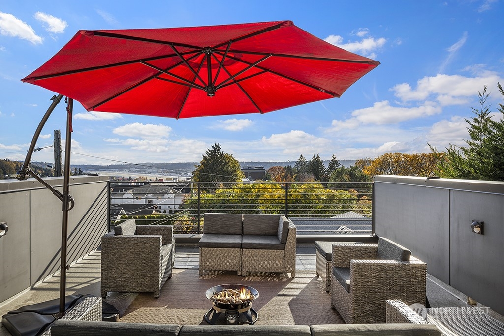 1406 South Bennett Street Seattle, WA 98108 - Photo 30 of 36 an outdoor space with furniture and umbrella