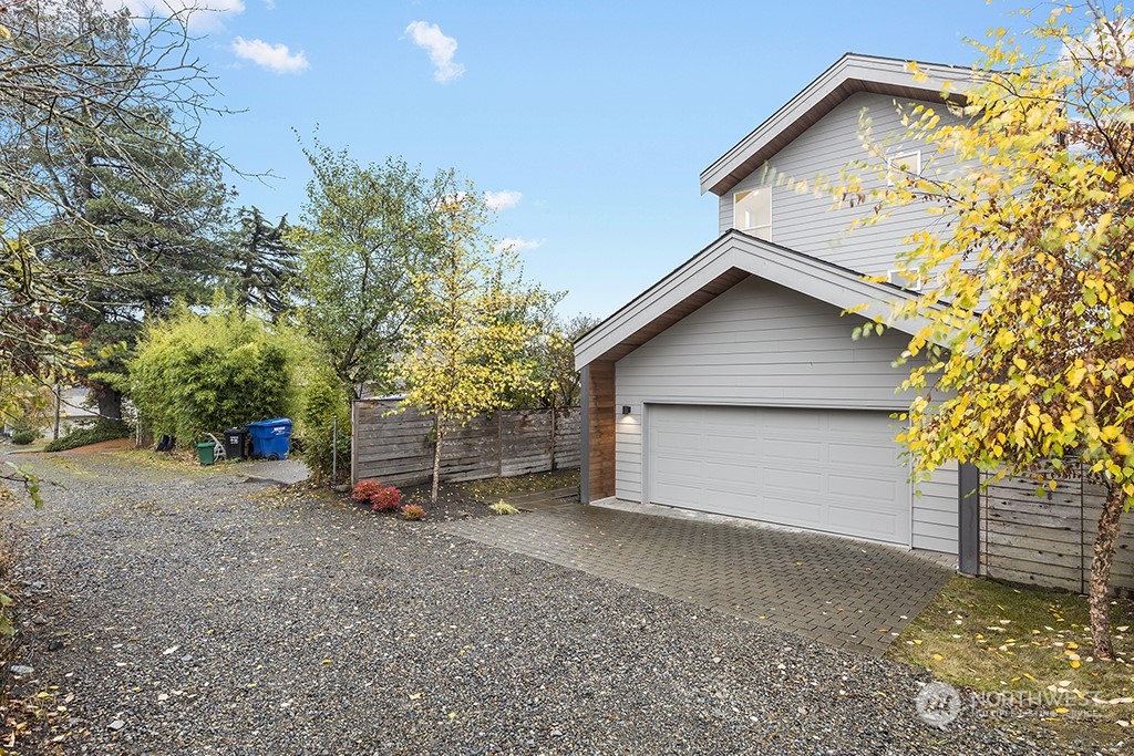 1406 South Bennett Street Seattle, WA 98108 - Photo 32 of 36 a view of a house with a yard and garage