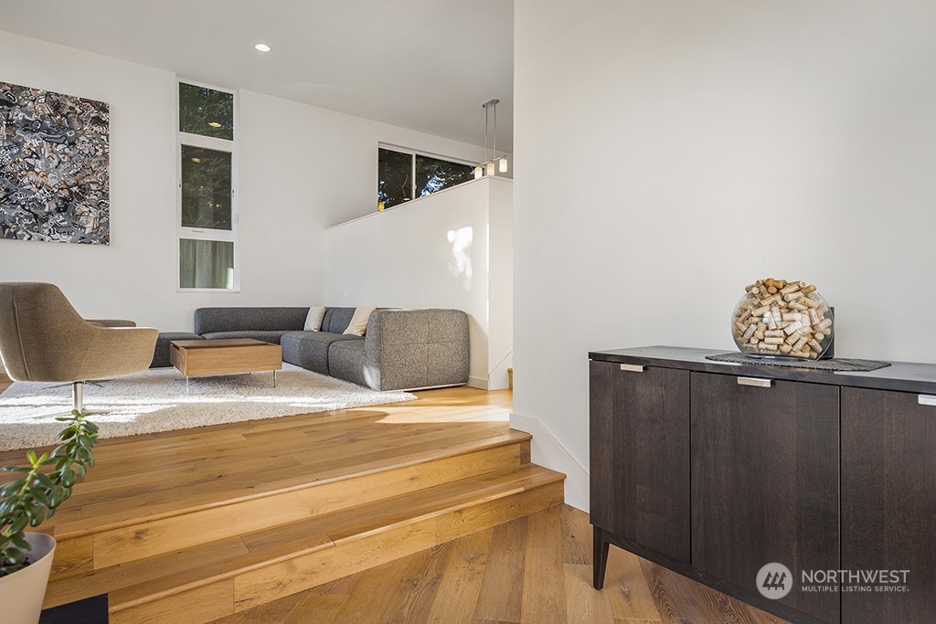1406 South Bennett Street Seattle, WA 98108 - Photo 6 of 36 a bedroom with a bed and wooden floor