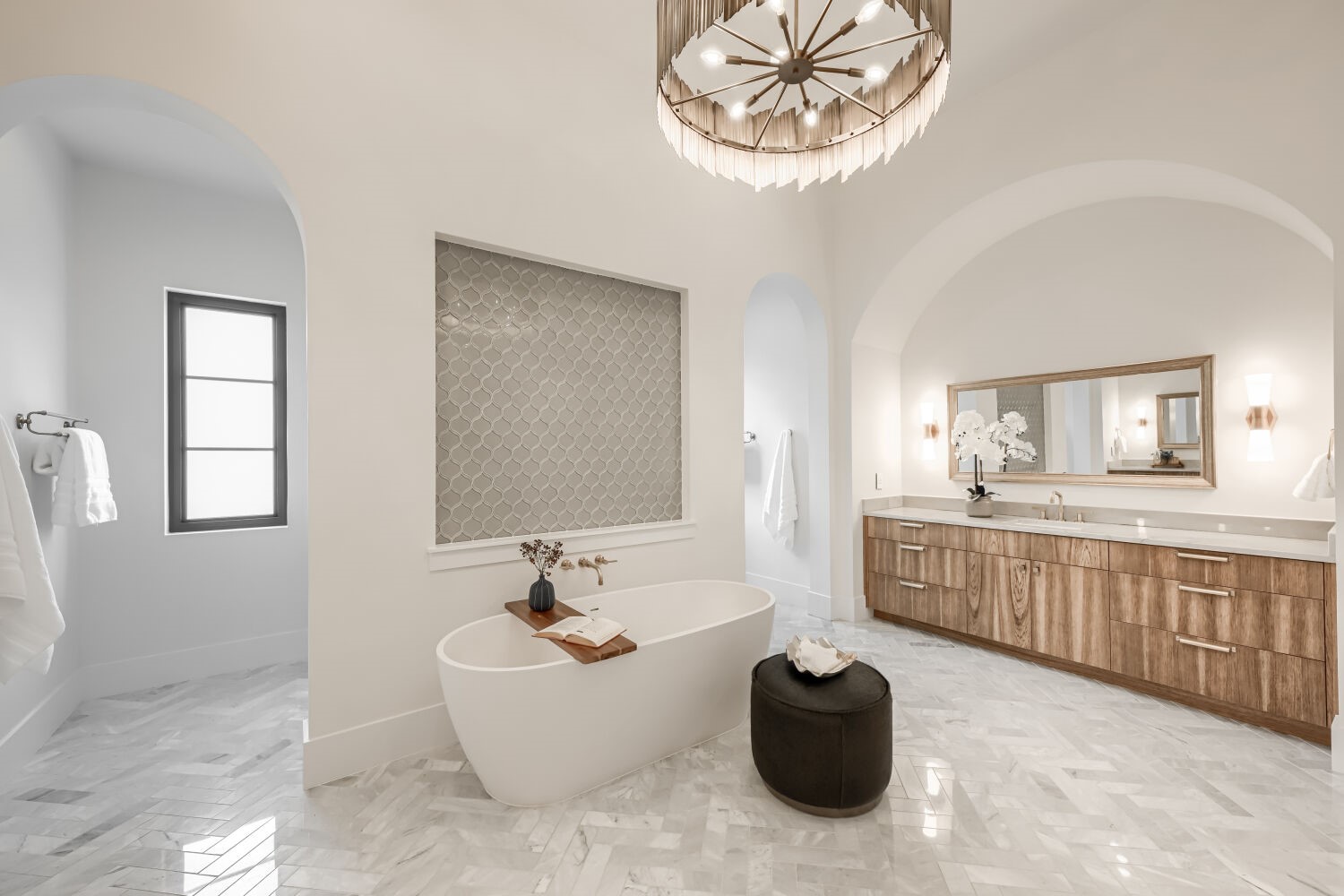 8132 Magnolia Ridge Cove Austin, TX 78738 - Photo 25 of 38 Luxurious spa-like retreat featuring arched doorways, sleek modern fixtures, and polished tile flooring.