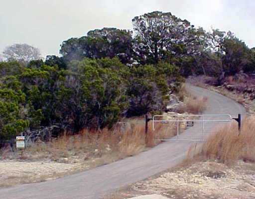 4701 Fischer Store Road Wimberley, TX 78676 - Photo 1 of 1 a view of a backyard of the house
