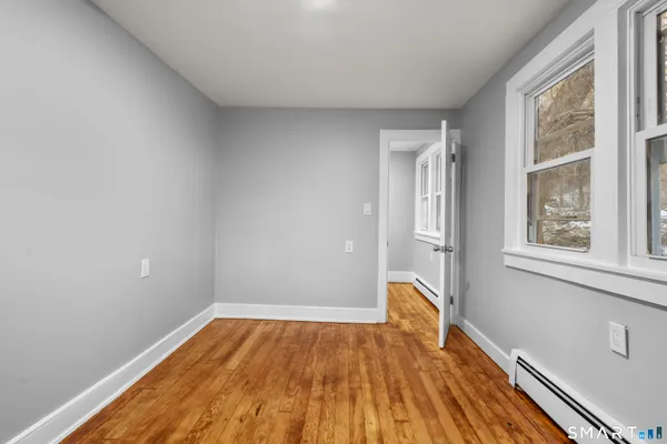 a view of an empty room with a window