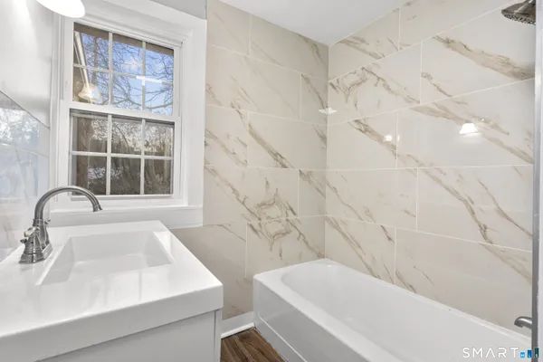 a bathroom with a sink and a bathtub