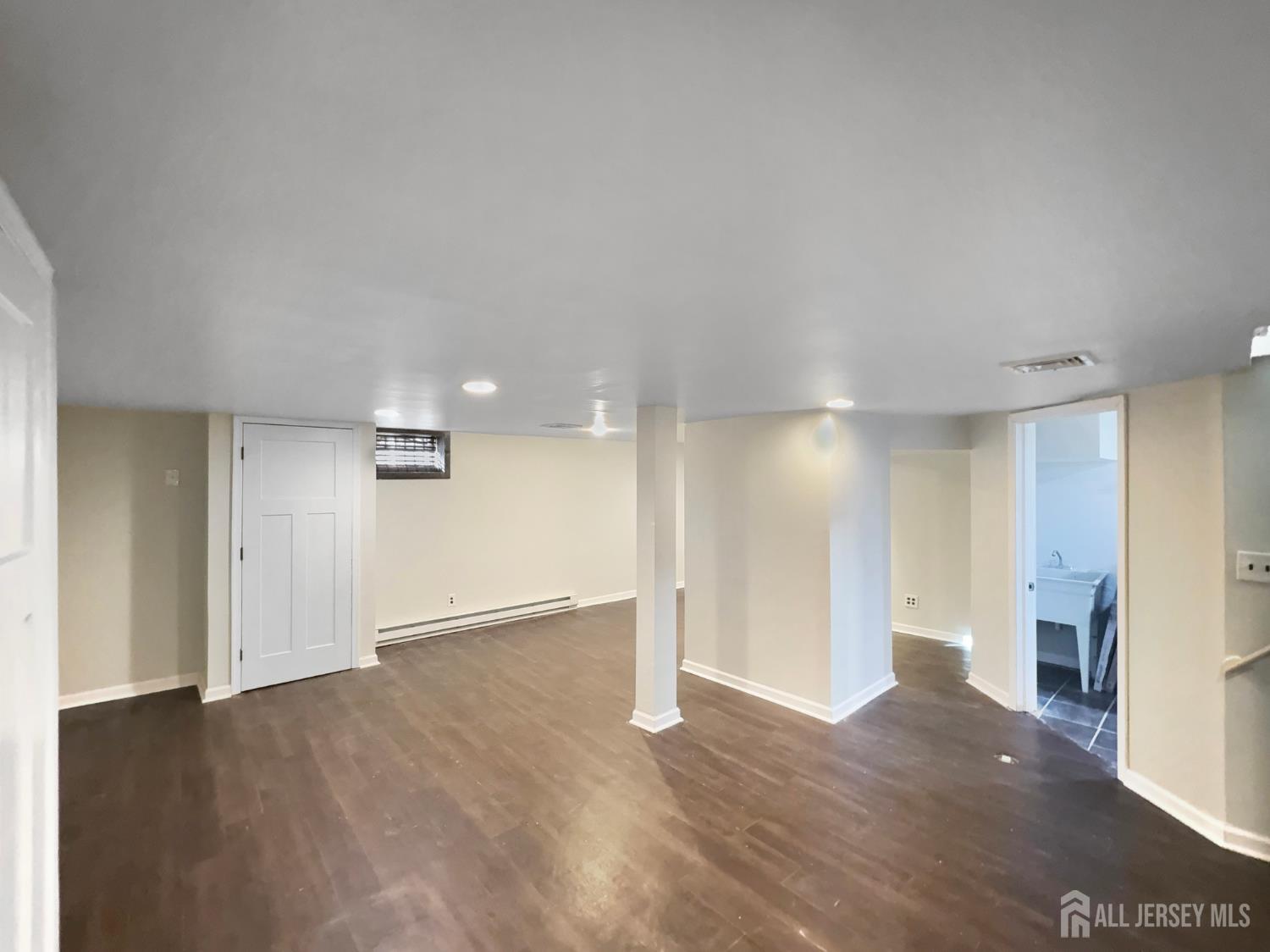 124 Lincoln Avenue Colonia, NJ 07067 - Photo 17 of 21 a view of empty room with wooden floor