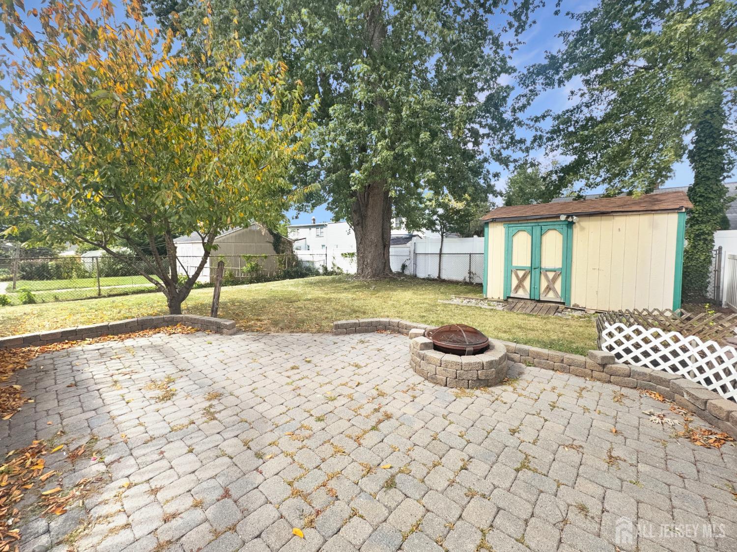 124 Lincoln Avenue Colonia, NJ 07067 - Photo 19 of 21 a swimming pool with outdoor seating and yard