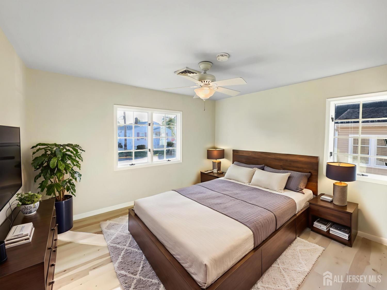 124 Lincoln Avenue Colonia, NJ 07067 - Photo 4 of 21 a bedroom with a bed table and a window