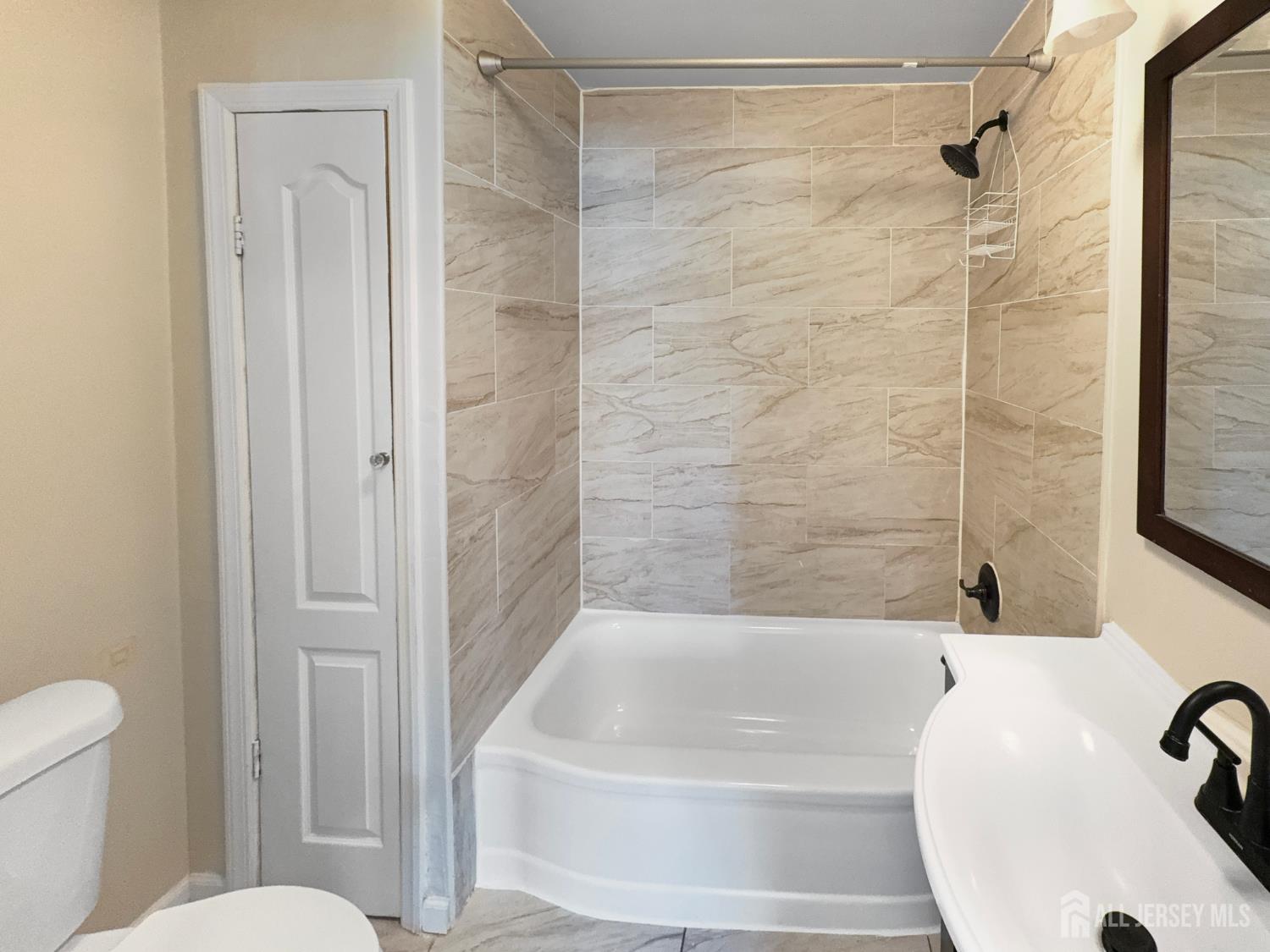 124 Lincoln Avenue Colonia, NJ 07067 - Photo 7 of 21 a bathroom with a bathtub and a shower