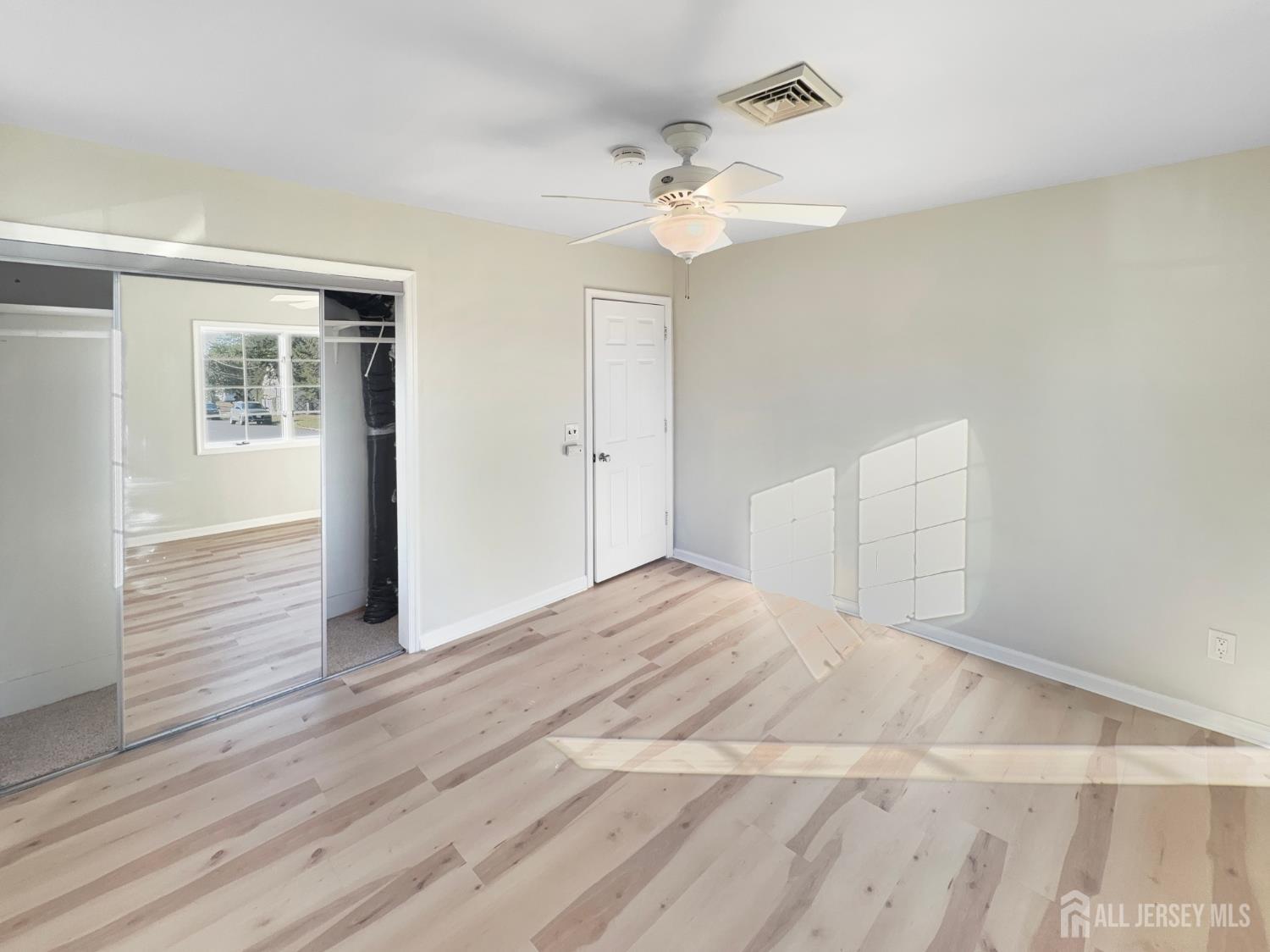 124 Lincoln Avenue Colonia, NJ 07067 - Photo 10 of 21 a view of empty room with wooden floor