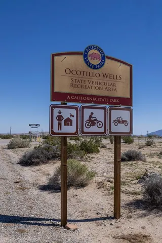 a street sign on a pole on a road