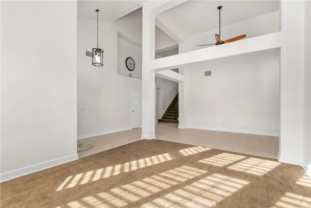 a bathroom with a granite countertop sink a mirror and a bathtub