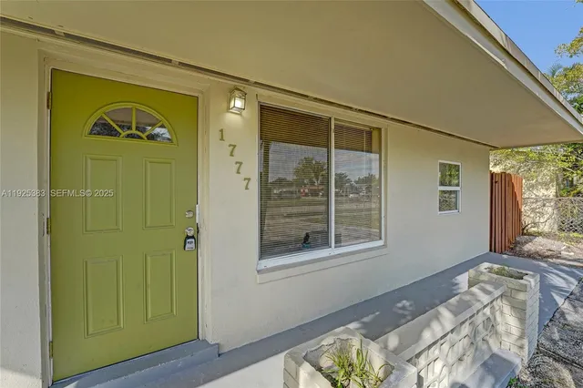 an empty room with a empty space and windows