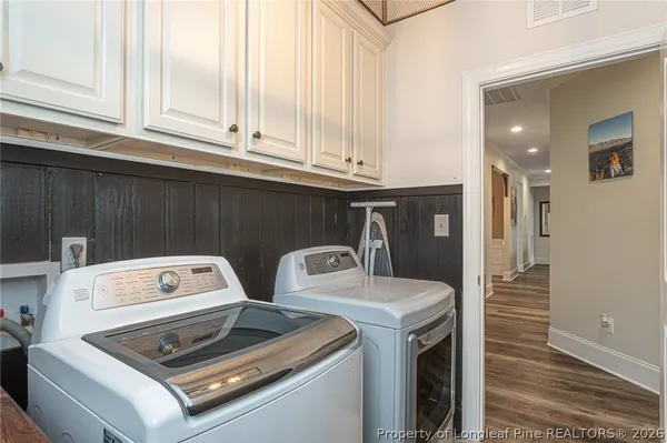 a utility room with dryer and washer
