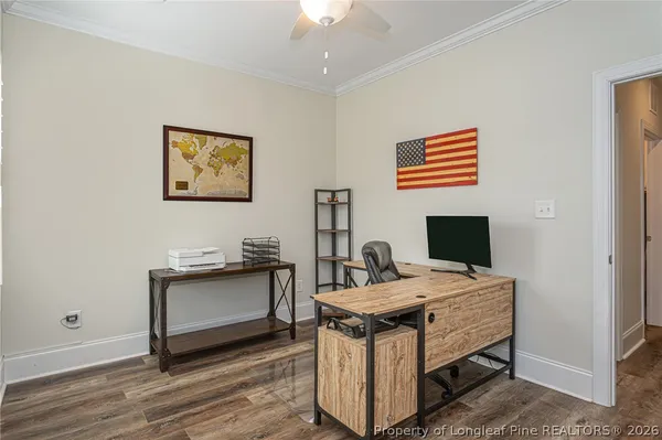 a view of a workspace with furniture