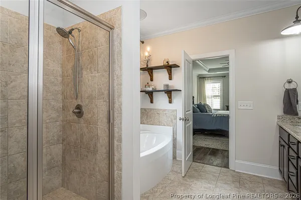 a bathroom with a walk in closet and a bathroom