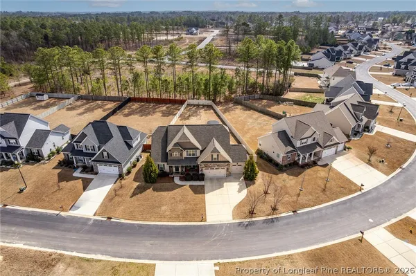an aerial view of a house with swimming pool