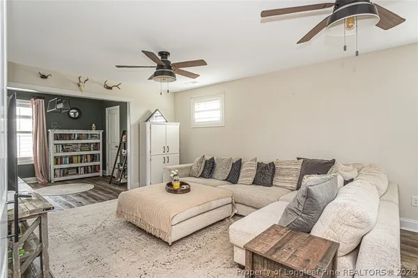 a living room with furniture and balcony