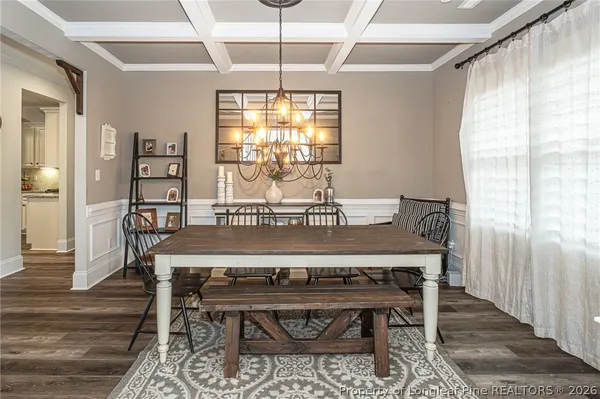 a view of a dining room with furniture and window
