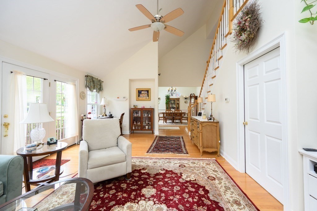 25 Hemlock Circle, Unit 25 Hanover, MA 02339 - Photo 11 of 36 a living room with furniture and a rug