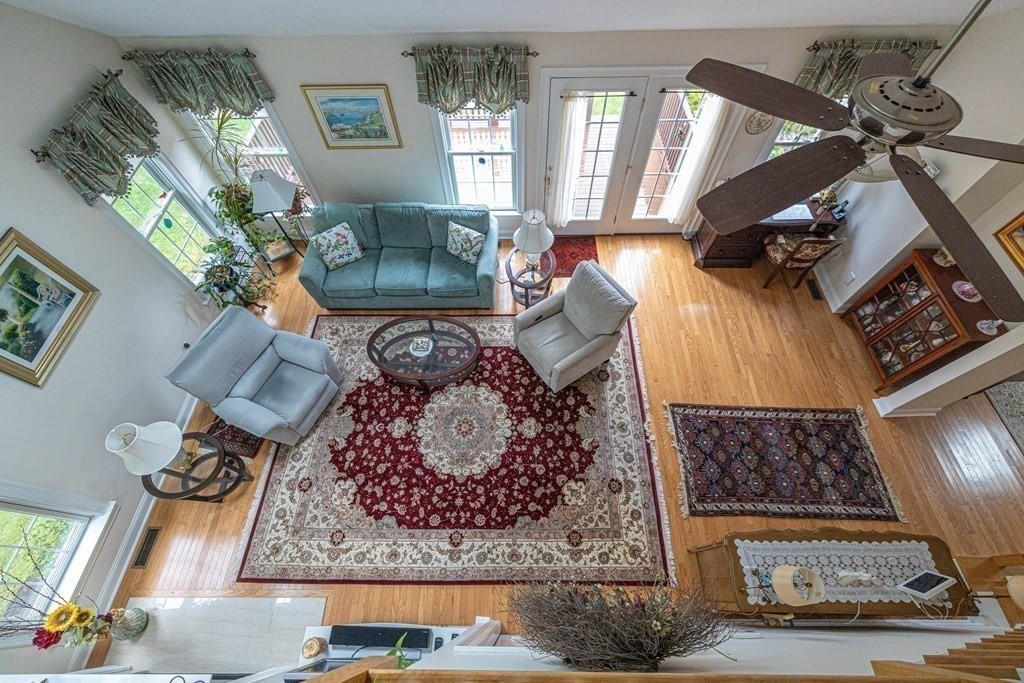 25 Hemlock Circle, Unit 25 Hanover, MA 02339 - Photo 14 of 36 a living room with furniture and a rug