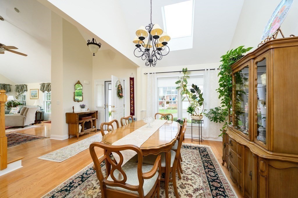 25 Hemlock Circle, Unit 25 Hanover, MA 02339 - Photo 17 of 36 a view of a dining room with furniture and a potted plant