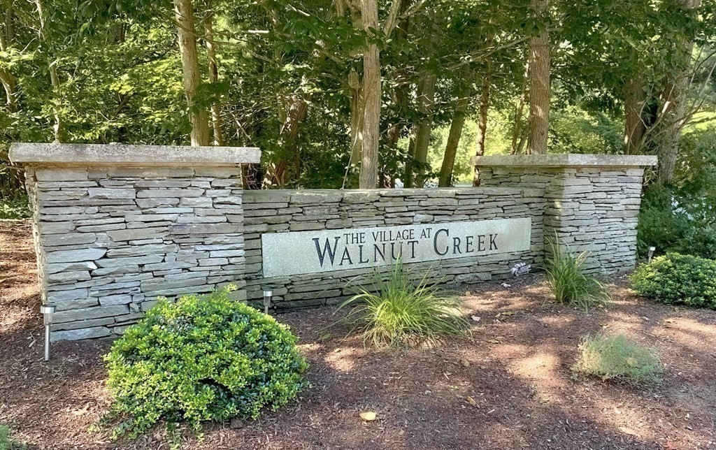 25 Hemlock Circle, Unit 25 Hanover, MA 02339 - Photo 19 of 36 a view of a street with trees