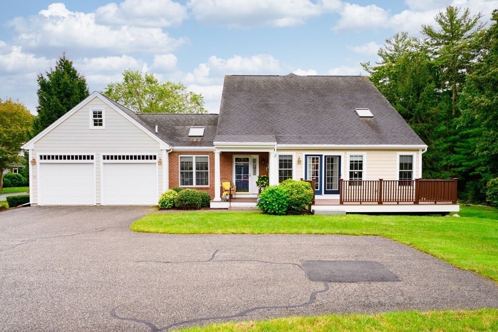 25 Hemlock Circle, Unit 25 Hanover, MA 02339 - Photo 2 of 36 a front view of a house with a yard and garage