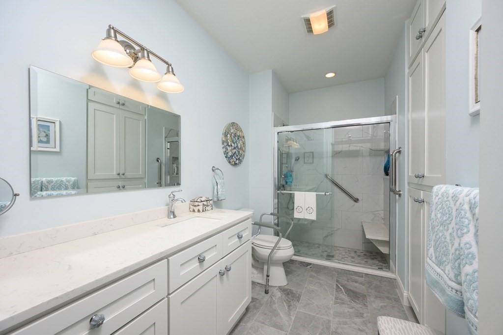 25 Hemlock Circle, Unit 25 Hanover, MA 02339 - Photo 23 of 36 a bathroom with a sink a toilet and shower