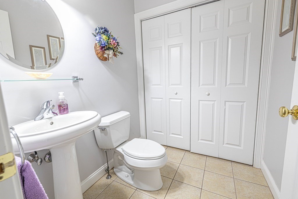 25 Hemlock Circle, Unit 25 Hanover, MA 02339 - Photo 24 of 36 a white toilet sitting next to a bathroom sink