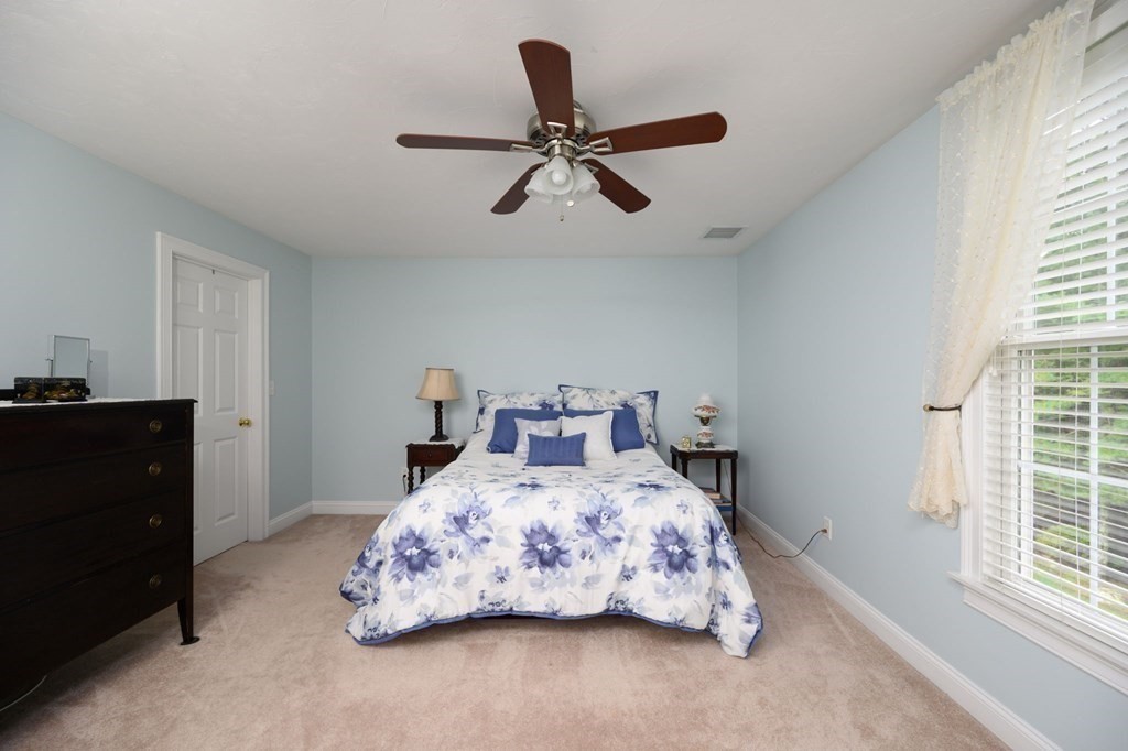 25 Hemlock Circle, Unit 25 Hanover, MA 02339 - Photo 26 of 36 a bedroom with a bed and window