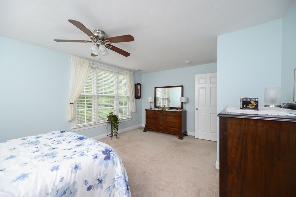 25 Hemlock Circle, Unit 25 Hanover, MA 02339 - Photo 27 of 36 a bedroom with a bed and a window