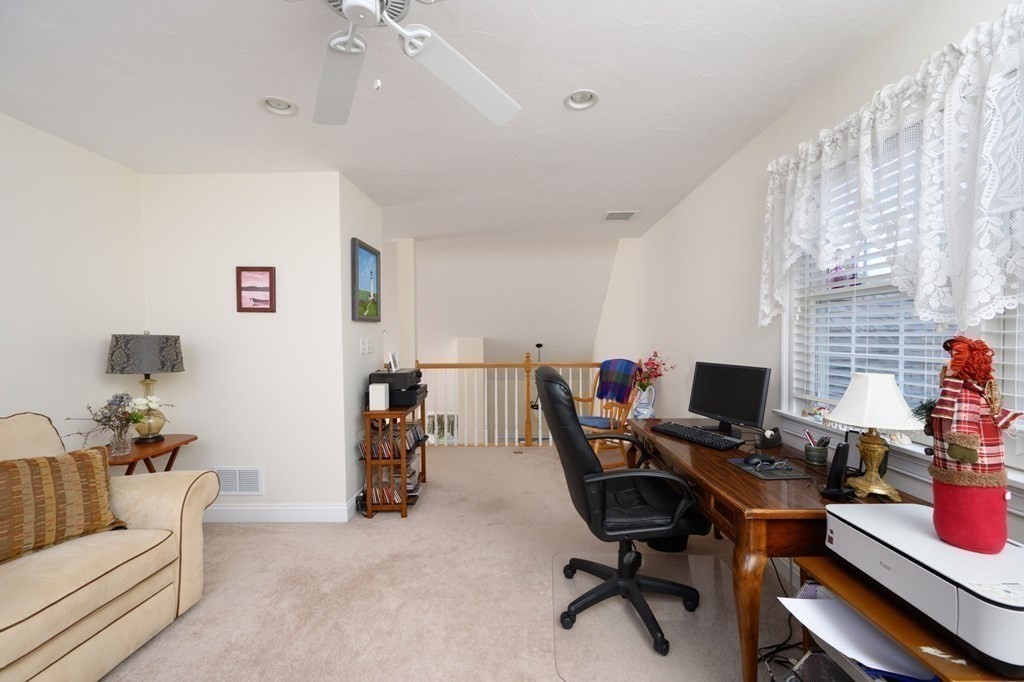 25 Hemlock Circle, Unit 25 Hanover, MA 02339 - Photo 28 of 36 a view of a workspace with furniture and a window