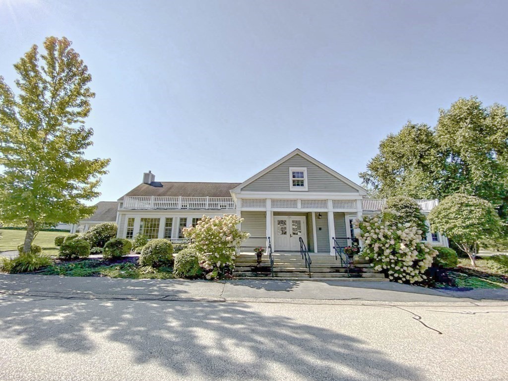 25 Hemlock Circle, Unit 25 Hanover, MA 02339 - Photo 32 of 36 a front view of a house with a yard