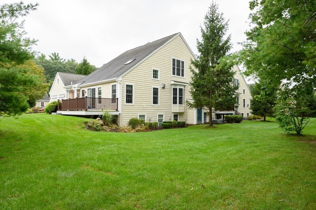 25 Hemlock Circle, Unit 25 Hanover, MA 02339 - Photo 4 of 36 a view of a house with a backyard