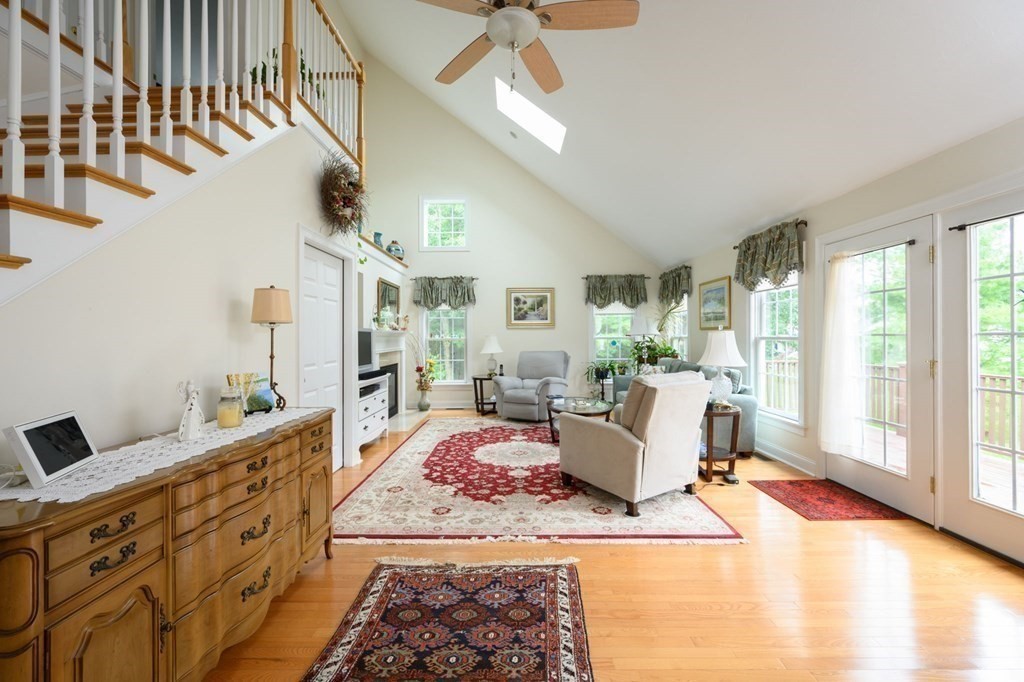 25 Hemlock Circle, Unit 25 Hanover, MA 02339 - Photo 10 of 36 a living room with furniture and a flat screen tv