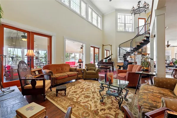 a kitchen with stainless steel appliances granite countertop wooden floors a stove and a sink