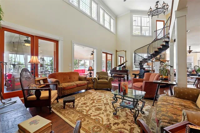 a kitchen with stainless steel appliances granite countertop wooden floors a stove and a sink