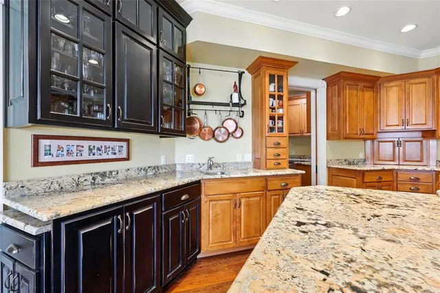a living room with furniture a rug and a floor to ceiling window